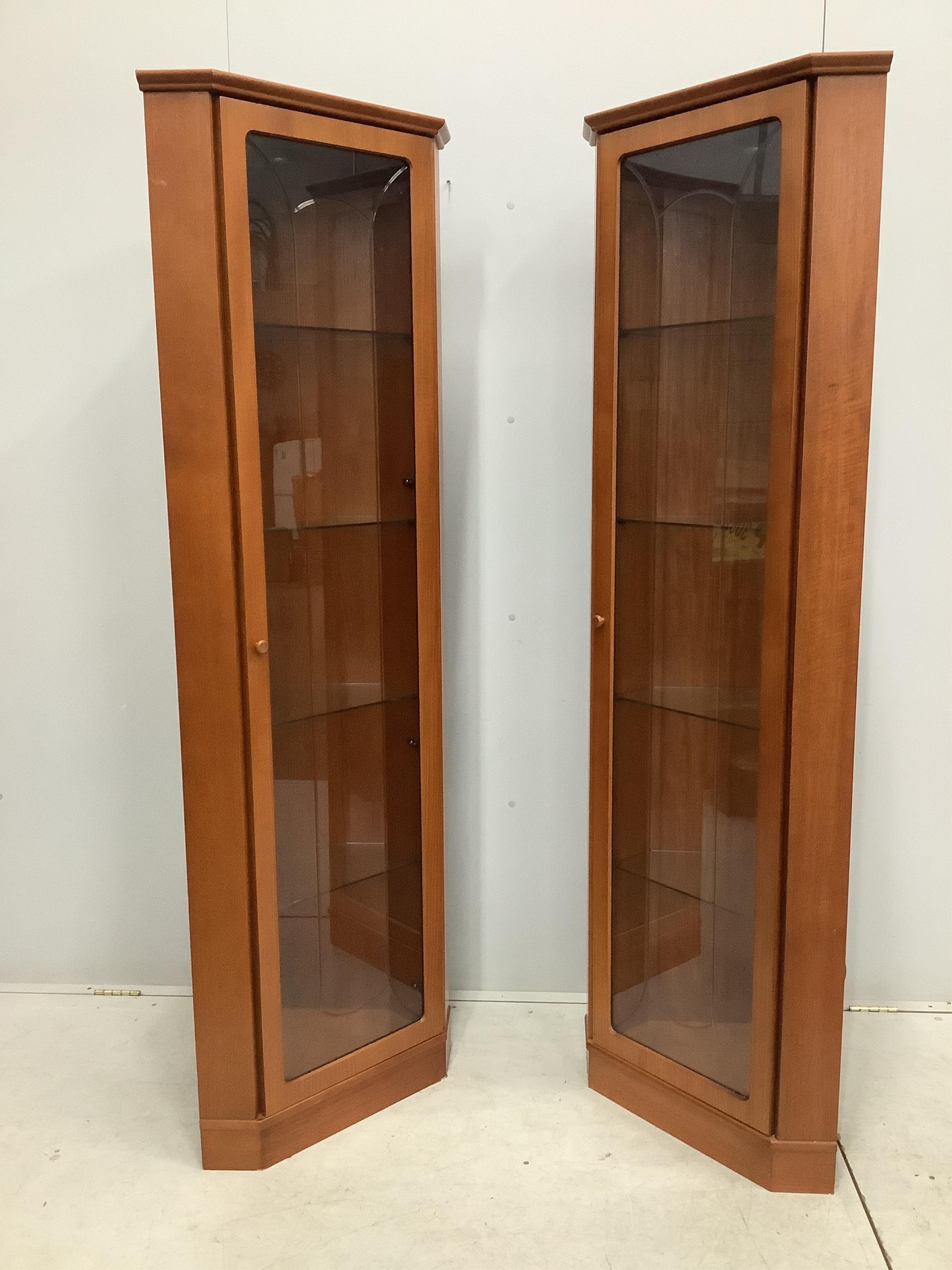 A pair of mid century G Plan teak corner cabinets, width 61cm, depth 39cm, height 185cm. Condition - good